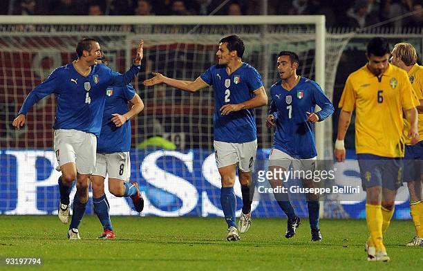 Giorgio Chiellini of Italy celebrates his opening goal with team mate Christian Maggio during the international friendly match between Italy and...