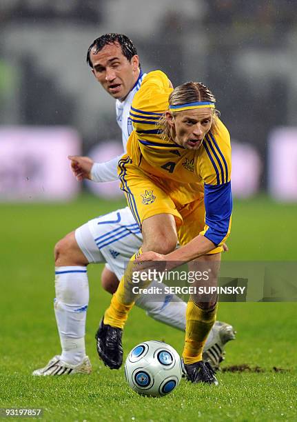 Ukraine's Anatoliy Tymoschuk fights for the ball with Greece's Georgios Samaras during their World Cup 2010 play-off qualification football match in...
