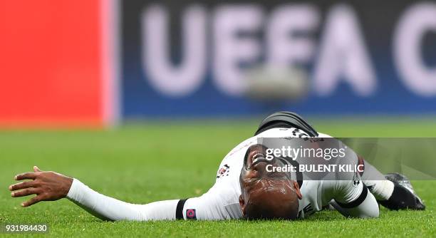 Besiktas forward Vágner Love reacts after a tackle during the second leg of the last 16 UEFA Champions League football match between Besiktas and...