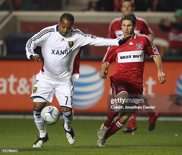 Andy Williams of Real Salt Lake prepares to pass the ball as Logan Pause of the Chicago Fire closes in during the MLS Eastern Conference Championship...