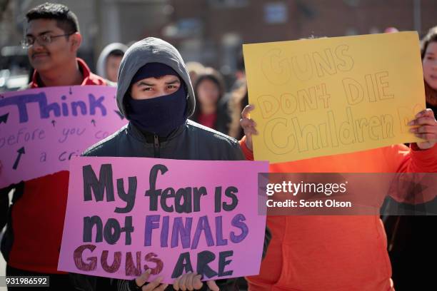 Students share thoughts about gun violence after walking out of their classes at Community Links High School in the city's violence-prone Little...