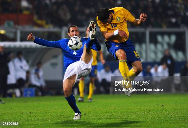 Giorgio Chiellini of Italy is challenged by Johan Elmander of Sweden during the international friendly match between Italy and Sweden at Dino Manuzzi...