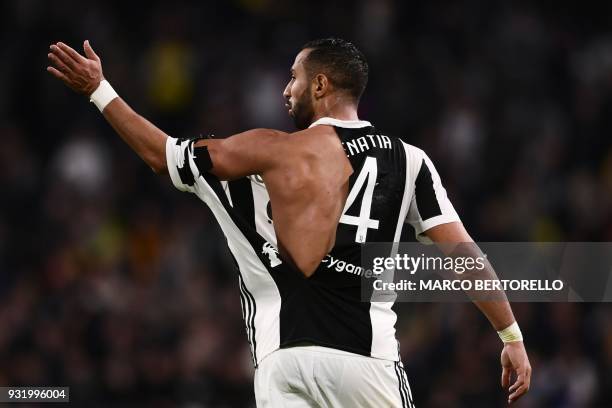 Juventus' Moroccan defender Mehdi Amine Benatia reacts after his t-shirt was ripped-up by Atalanta's Dutch midfielder Marten de Roon during the...