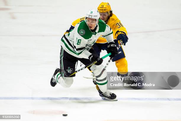 Tyler Pitlick of the Dallas Stars skates against Ryan Hartman of the Nashville Predators during an NHL game at Bridgestone Arena on March 6, 2018 in...