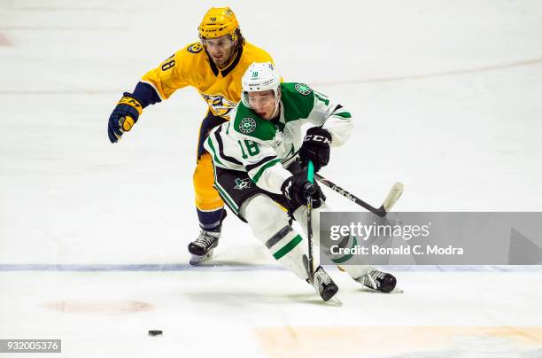 Tyler Pitlick of the Dallas Stars skates against Ryan Hartman of the Nashville Predators during an NHL game at Bridgestone Arena on March 6, 2018 in...