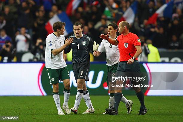 Kevin Kilbane , Shay Given and Keith Andrews of Ireland protest to referee Martin Hansson of Sweden after allowing the French goal scored by William...