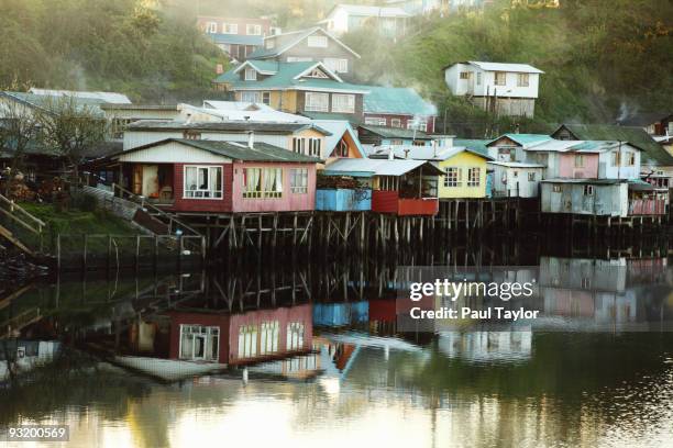 houses on stilts over water - stilt stock pictures, royalty-free photos & images