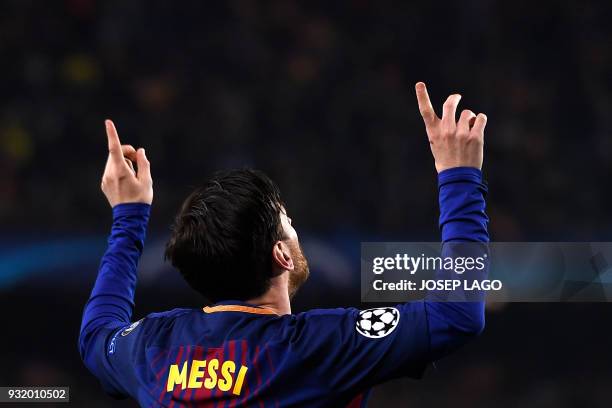 Barcelona's Argentinian forward Lionel Messi celebrates after scoring a goal during the UEFA Champions League round of sixteen second leg football...