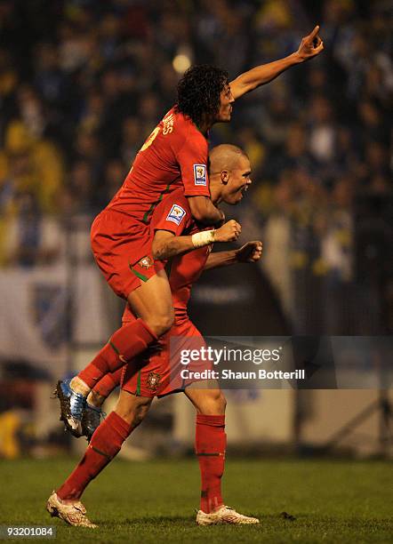 Bruno Alves and Pepe of Portugal celebrate at the end of the FIFA2010 World Cup Qualifier 2nd Leg match between Bosnia-Herzegovina and Portugal on...