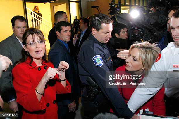 Former Republican vice presidential candidate and Alaska Governor Sarah Palin talks with NBC reporter Andrea Mitchell as she arrives for a book...