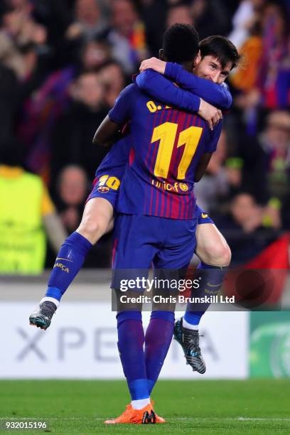 Ousmane Dembele of FC Barcelona celebrates with teammate Lionel Messi after scoring his sides second goal during the UEFA Champions League Round of...