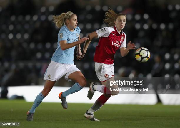 Vivianne Miedema of Arsenal is challenged by Steph Houghton of Manchester City during the WSL Continental Cup Final between Arsenal Women and...