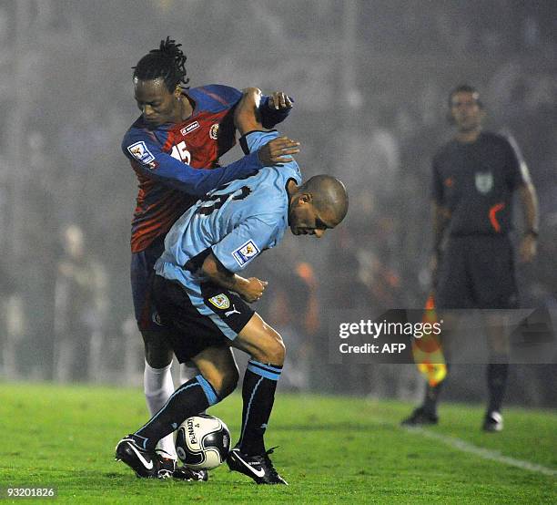 Uruguay's Maximiliano Pereira and Costa Rican Junior Diaz during a FIFA World Cup South Africa 2010 qualifier football match at the Centenario...