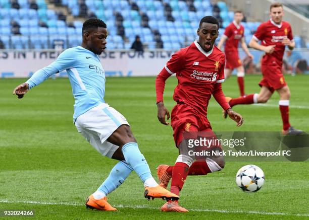 Rafael Camacho of Liverpool and Tom Dele-Bashiru of Manchester City in action during the Manchester City v Liverpool UEFA Youth League game at...