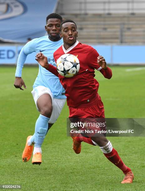 Rafael Camacho of Liverpool and Tom Dele-Bashiru of Manchester City in action during the Manchester City v Liverpool UEFA Youth League game at...