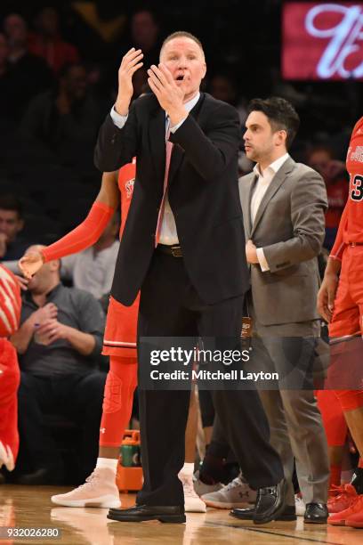 Head coach Chris Mullin of the St. John's Red Storm signals to his players during the 1st round of the Big East Basketball Tournament against the...