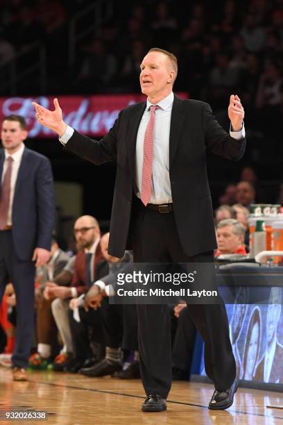 Head coach Chris Mullin of the St. John's Red Storm signals to his players during the 1st round of the Big East Basketball Tournament against the...