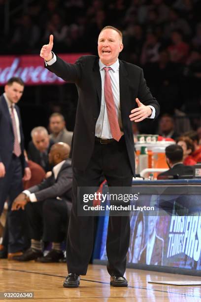 Head coach Chris Mullin of the St. John's Red Storm signals to his players during the 1st round of the Big East Basketball Tournament against the...