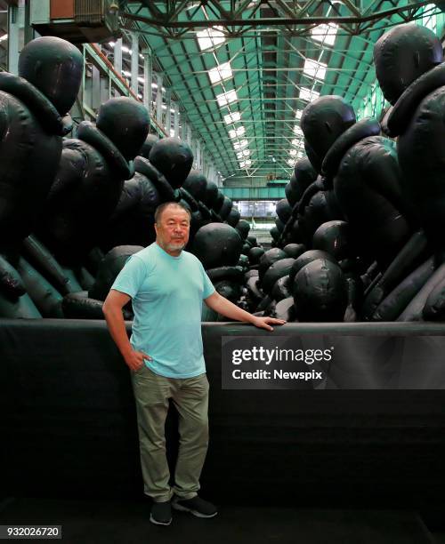 Chinese artist Ai Weiwei poses with his artwork 'Law of the Journey' at Cockatoo Island in Sydney, New South Wales. He will be exhibiting as part of...