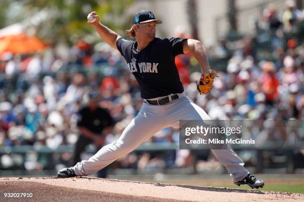 Chance Adams of the New York Yankees pitches during the first inning of the Spring Training game against the Baltimore Orioles at Spectrum Field on...