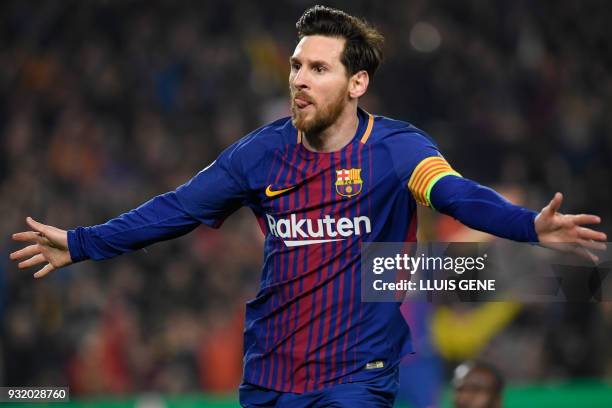 Barcelona's Argentinian forward Lionel Messi celebrates scoring his team's third goal during the UEFA Champions League round of sixteen second leg...