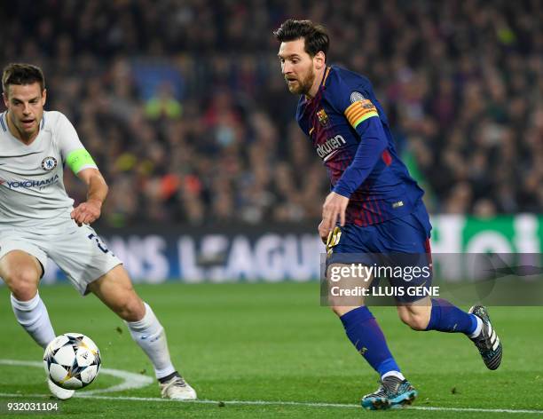 Barcelona's Argentinian forward Lionel Messi prepares to shoot and score his second goal during the UEFA Champions League round of sixteen second leg...