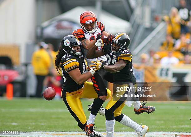 William Gay and Troy Polamalu of the Pittsburgh Steelers break up the pass play to Laveranues Coles of the Cincinnati Bengals during their game at...