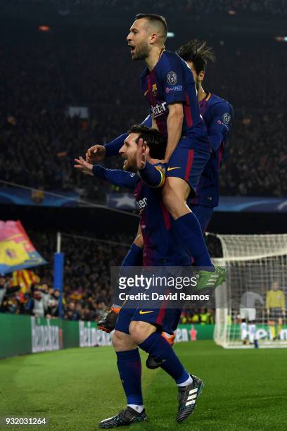 Lionel Messi of Barcelona celebrates with Jordi Alba and Andre Gomes of Barcelona as he scores their third goal during the UEFA Champions League...