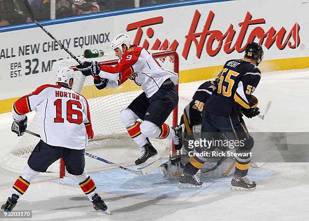 TeBUFFALO, NY Stephen Weiss of the Florida Panthers jumps through the crease past teammate Nathan Horton with Ryan Miller and Jochen Hecht of the...