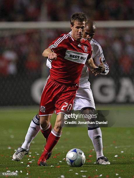 Brian McBride of the Chicago Fire controls the ball against Jamison Olave of Real Salt Lake during the MLS Eastern Conference Championship at Toyota...