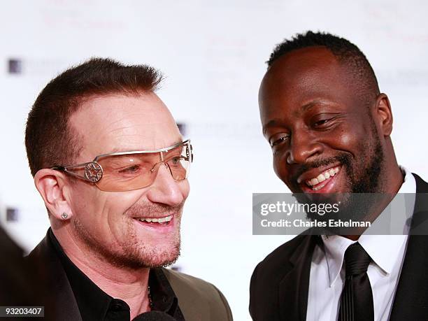 Singer Bono and musician Wyclef Jean attend the RFK Center Ripple of Hope Awards dinner at Pier Sixty at Chelsea Piers on November 18, 2009 in New...
