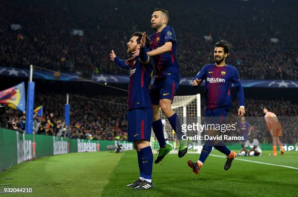 Lionel Messi of Barcelona celebrates with Jordi Alba and Andre Gomes as he scores their third goal during the UEFA Champions League Round of 16...