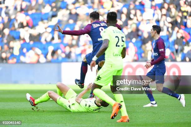 Thiago Motta of PSG lands with his studs on Romain Thomas of Angers and receives a red card during the Ligue 1 match between Paris Saint Germain and...