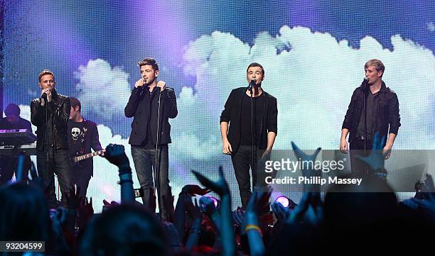 Nicky Byrne, Mark Feehily, Shane Filan and Kian Egan from Westlife perform at the Cheerio's Childline Concert on November 18, 2009 in Dublin, Ireland.