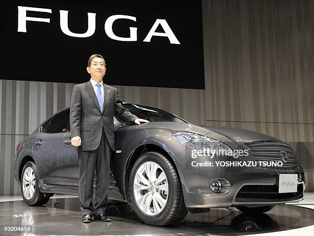 Of Japanese auto giant Nissan Motor, Toshiyuki Shiga, introduces the company's new luxury sedan "Fuga", equipped with 2.5 or 3.7-litre V6 engines, at...