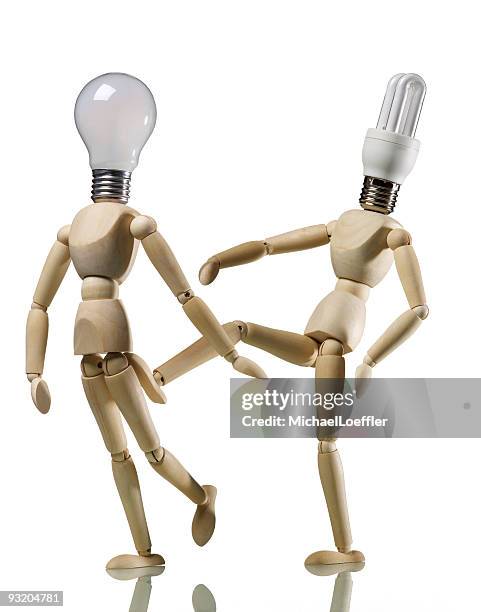 energy saving lamp vs. light bulb - energiesparlampe stock pictures, royalty-free photos & images