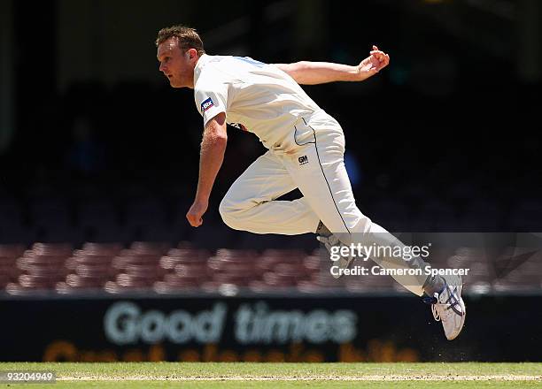 Doug Bollinger of the Blues bowls during day three of the Sheffield Shield match between the New South Wales Blues and the Tasmanian Tigers at Sydney...