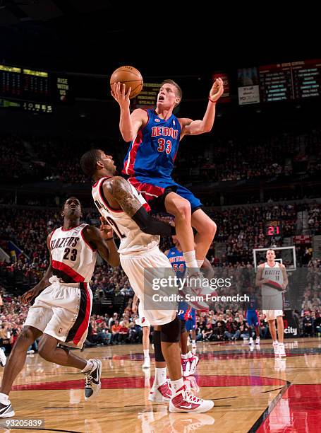 Jonas Jerebko of the Detroit Pistons goes up for a shot over LaMarcus Aldridge of the Portland Trail Blazers during a game on November 18, 2009 at...