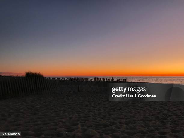 sunset beach in cape may, nj - delaware bay stock-fotos und bilder