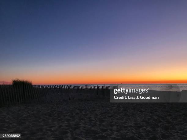 sunset beach in cape may, nj - delaware bay stock-fotos und bilder