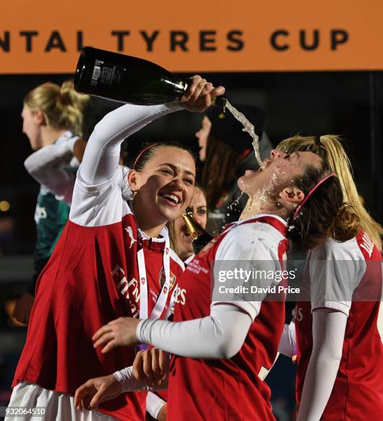 Katie McCabe and Emma Mitchell of Arsenal Women celebrate winning the Continenal Cup Trophy after the match between Arsenal Women and Manchester City...