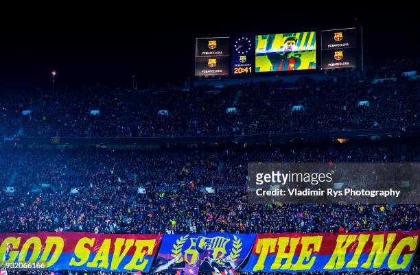 Barcelona fans roll out a giant banner saying "God save the King" and a picture of Barcelona superstar Lionel Messi prior to the UEFA Champions...