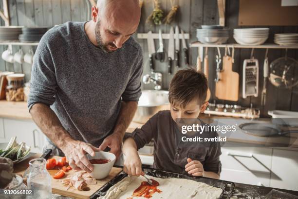 father's little bakers - making pizza stock pictures, royalty-free photos & images