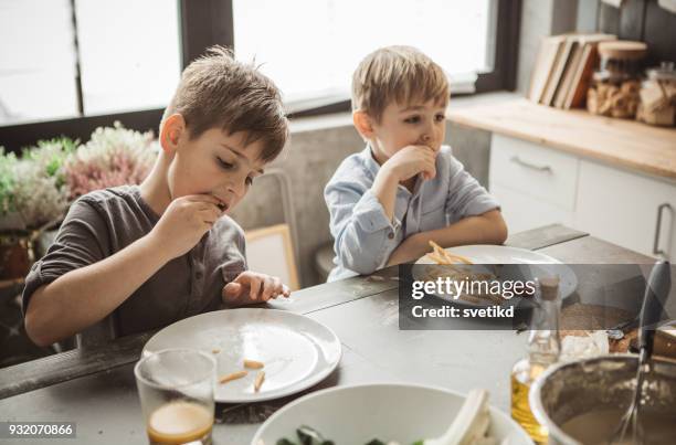 who eats faster will win - french fries stock pictures, royalty-free photos & images