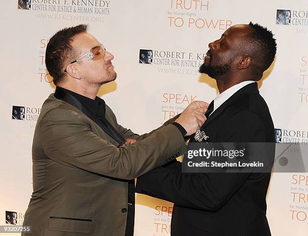 Singers Bono and Wyclef Jean attend the RFK Center Ripple of Hope Awards dinner at Pier Sixty at Chelsea Piers on November 18, 2009 in New York City.