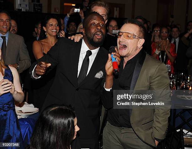 Singers Wyclef Jean and Bono attend the RFK Center Ripple of Hope Awards dinner at Pier Sixty at Chelsea Piers on November 18, 2009 in New York City.