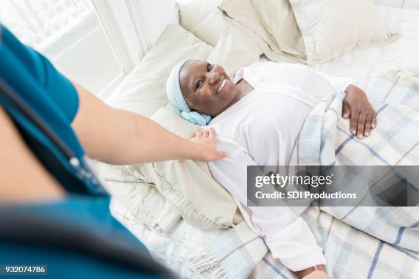 unrecognizable nurse checks on senior patient - personal perspective doctor stock pictures, royalty-free photos & images