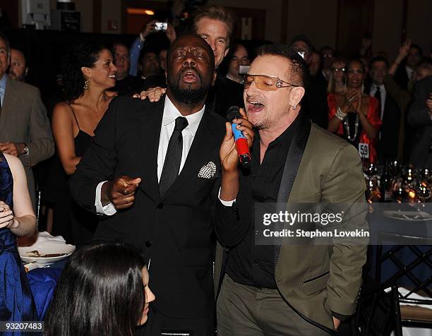 Singers Wyclef Jean and Bono attend the RFK Center Ripple of Hope Awards dinner at Pier Sixty at Chelsea Piers on November 18, 2009 in New York City.