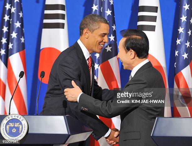 President Barack Obama shakes hands with South Korean President Lee Myung-Bak following a joint press conference at the presidential Blue House in...