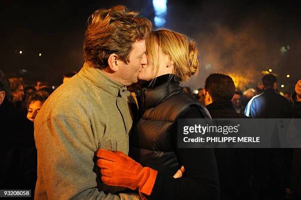 People kiss during the official launch of the 2009 Beaujolais Nouveau wine on 18 November, 2009 in Beaujeu, central eastern France. The third...